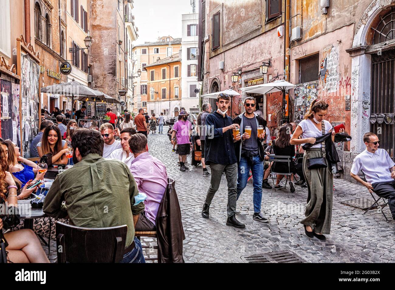 People out and about enjoying an early evening drink in Rome's Trastevere district Stock Photo