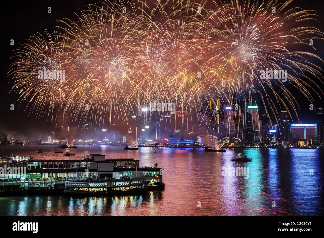 Spectacular national day fireworks display above Victoria Harbour. Photo taken from Harbour City, Tsim Sha Tsui. Stock Photo