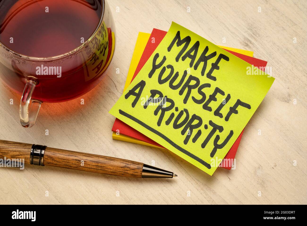 Make yourself a priority advice or reminder - handwriting on a sticky ...
