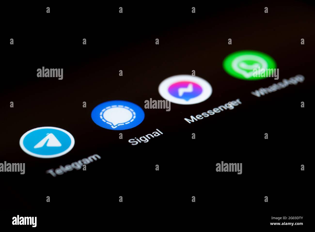 31-05-2021 Hamburg, Germany: close-up view of app icons of different messaging apps on smartphone display, Telegram, Signal, Facebook Messenger and Stock Photo