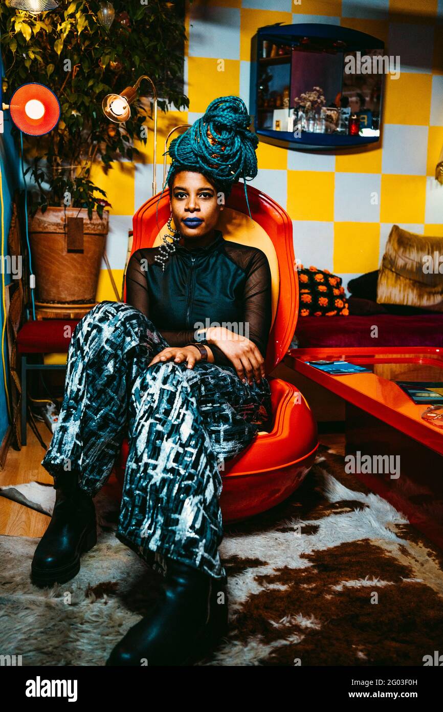 Woman sitting chair full length hi-res stock photography and images - Alamy