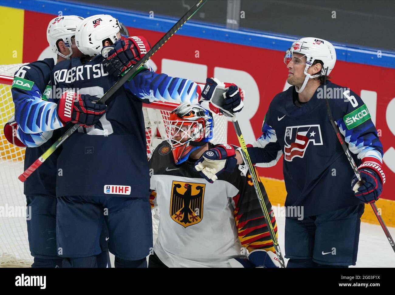 31 May 2021, Latvia, Riga: Ice hockey: World Championship, preliminary round, group B, USA - Germany: Germany's Felix Bruckmann (2nd from right) could not keep the goal of Jason Robertson (2nd from left) - on the right Chris Wideman from the USA. Photo: Roman Koksarov/dpa Stock Photo