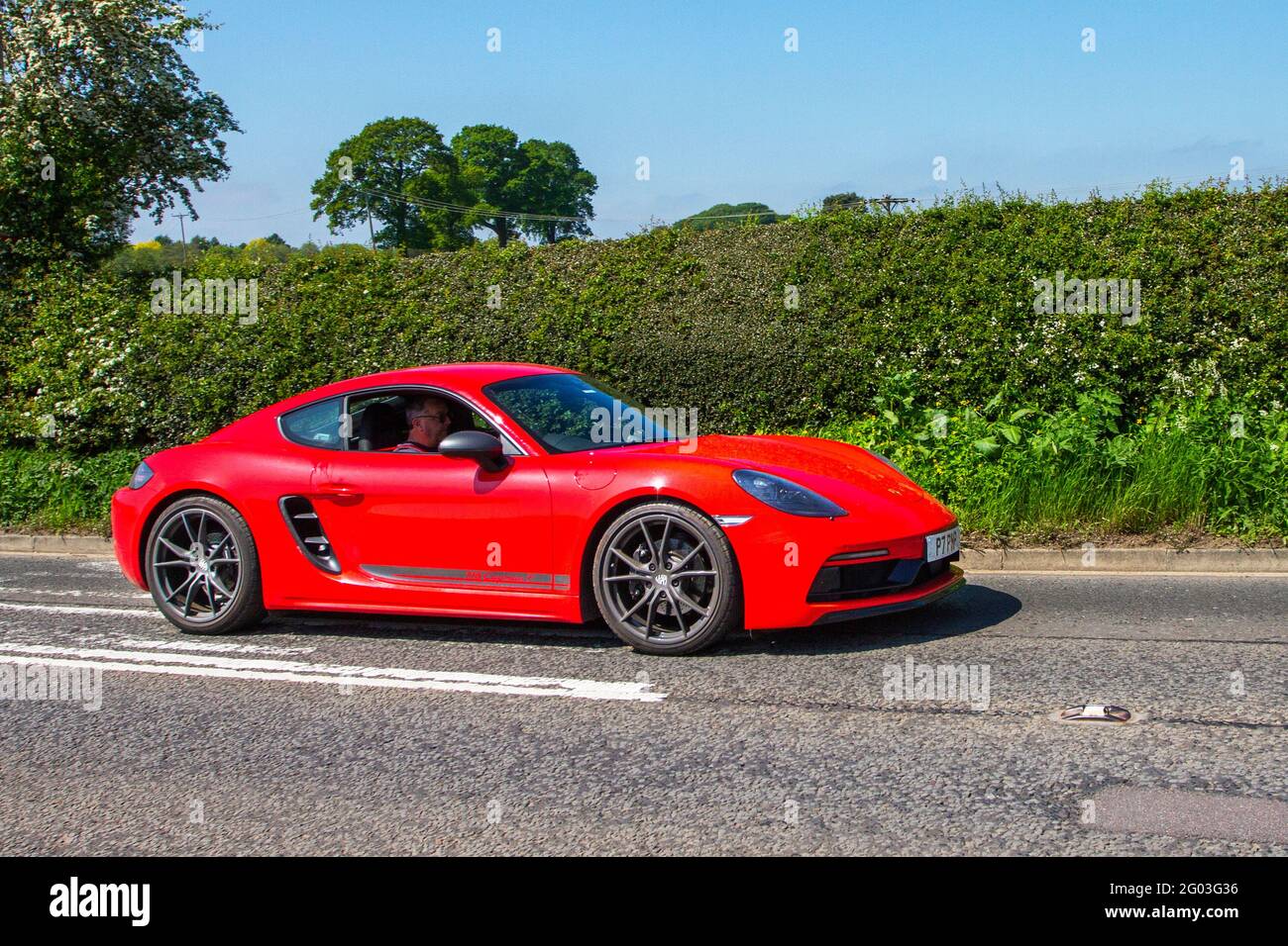 2020 red Porsche 718 Cayman T S-A 1988cc petrol coupe en-route to Capesthorne Hall in Cheshire, UK Stock Photo