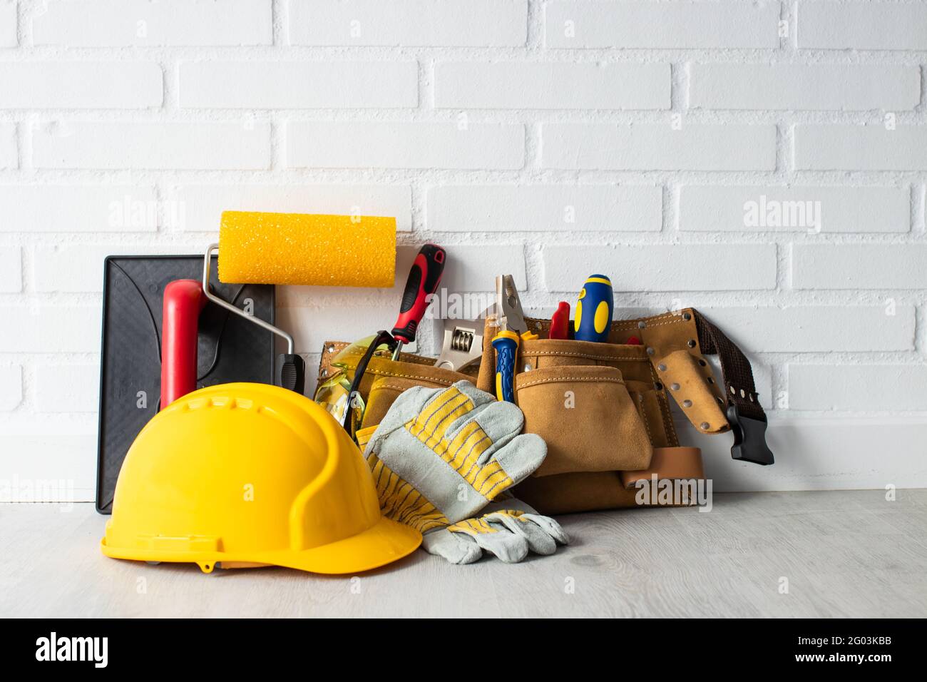 construction worker helmet with tools Stock Photo