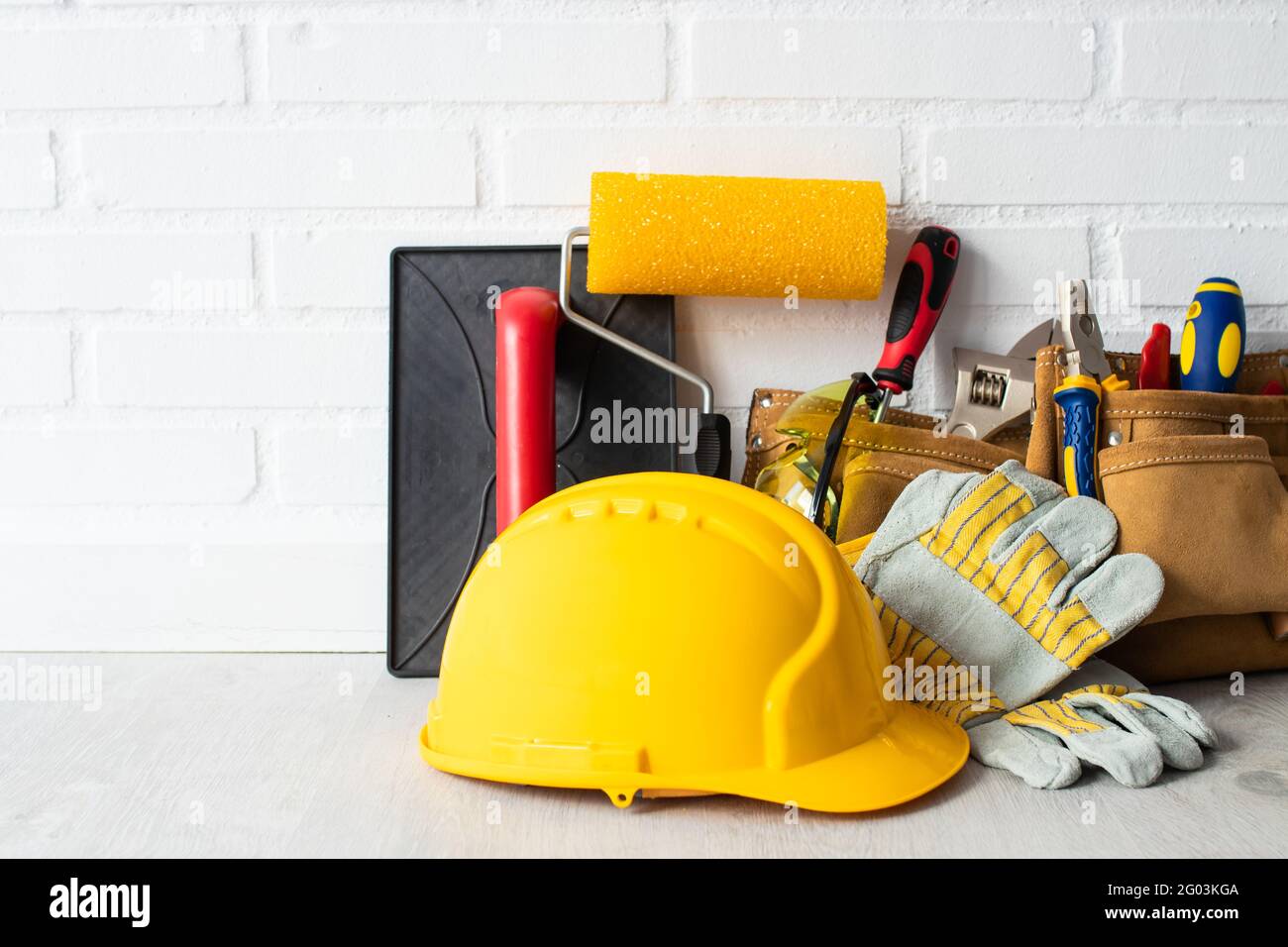 construction worker helmet with tools Stock Photo