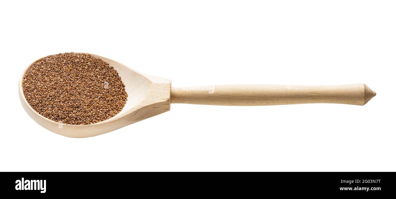 whole-grain teff seeds in wooden spoon isolated on white background Stock Photo