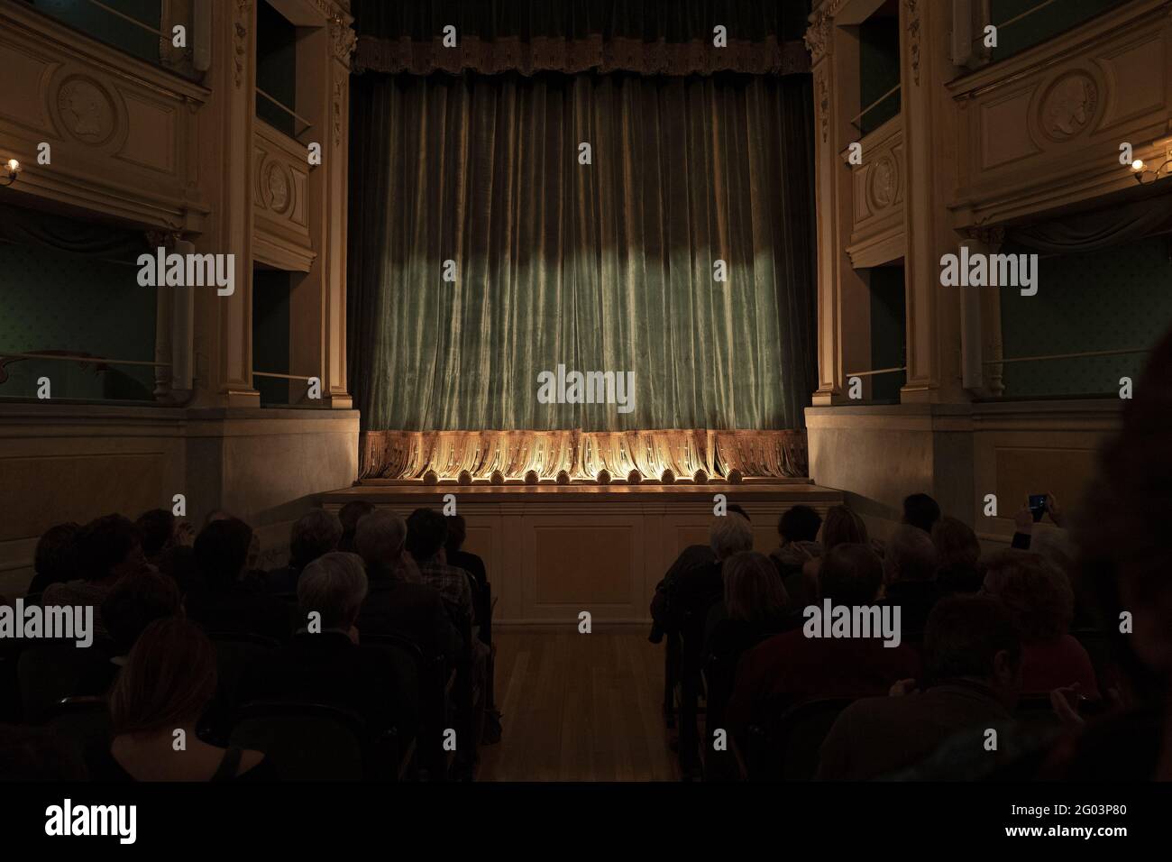 People attend a puppet theater show of the historical milanese Marionette Colla company, at the historical Gerolamo theatre founded in 1868, in Milan. Stock Photo