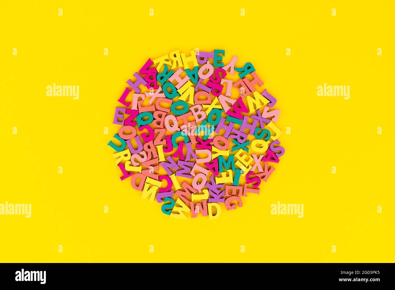 Flat lay top view letters on yellow background Stock Photo