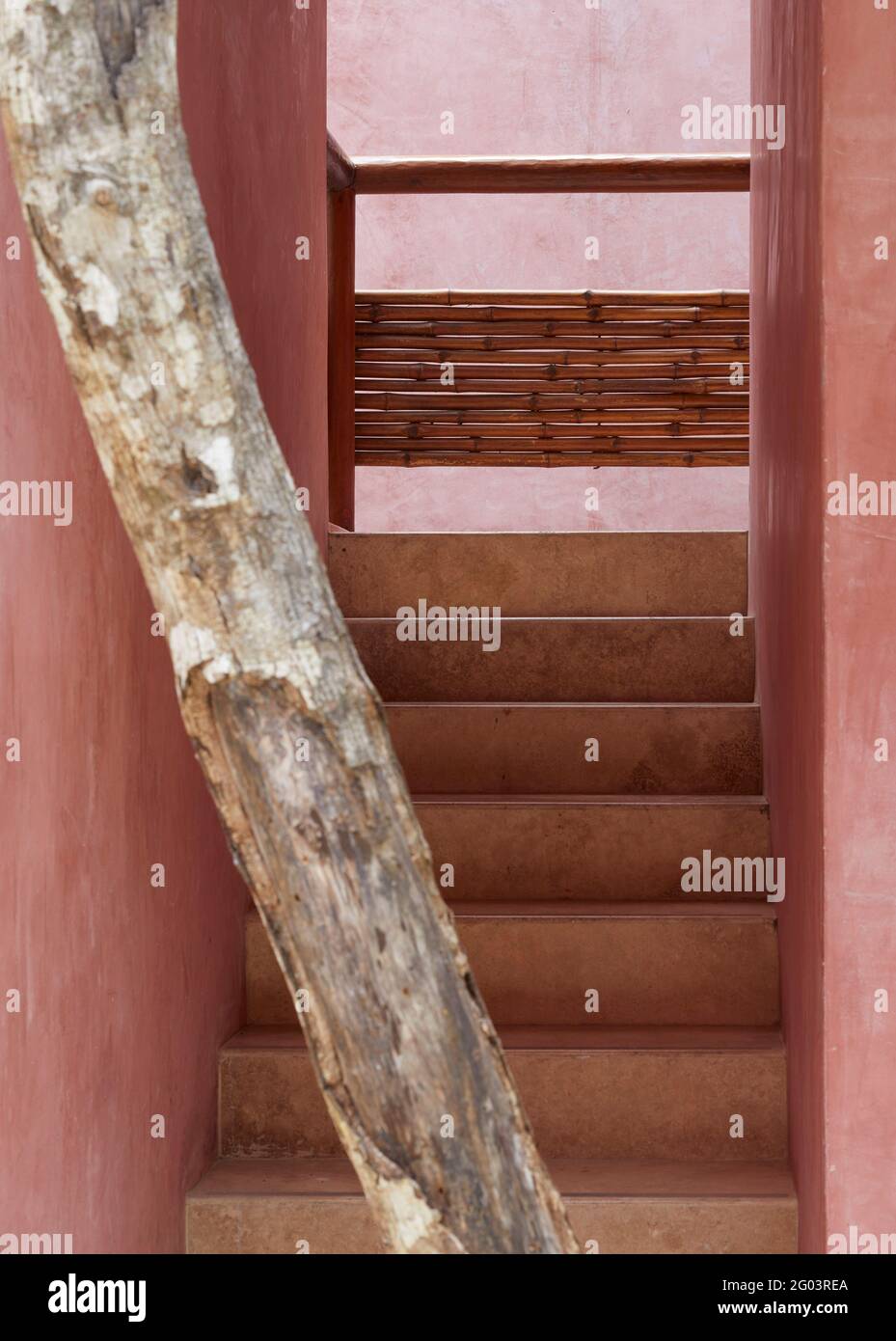 Interior of public corridor and stairs. Tulum Apartments, Tulum, Mexico. Architect Reyes Rios