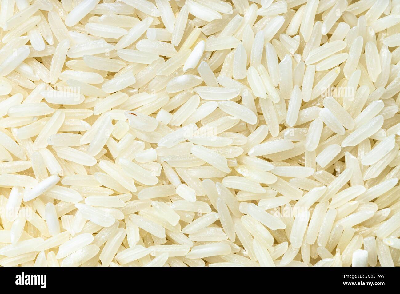 food background uncooked polished longgrain jasmine rice Stock Photo