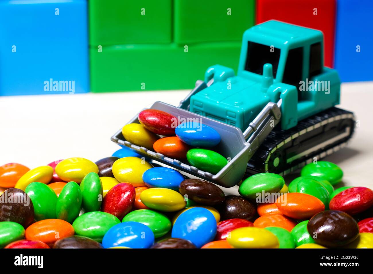 sweet color candy, Kids Toy Tractors. Toy heavy excavator Stock Photo