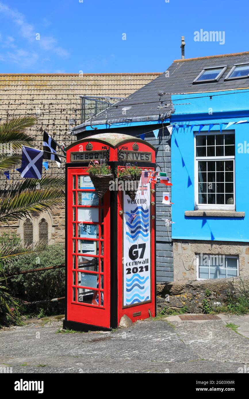 Red phone box in St Ives, decorated to welcome the G7 summit to Cornwall, taking place in Carbis Bay, June 11th-13th 2021, UK Stock Photo