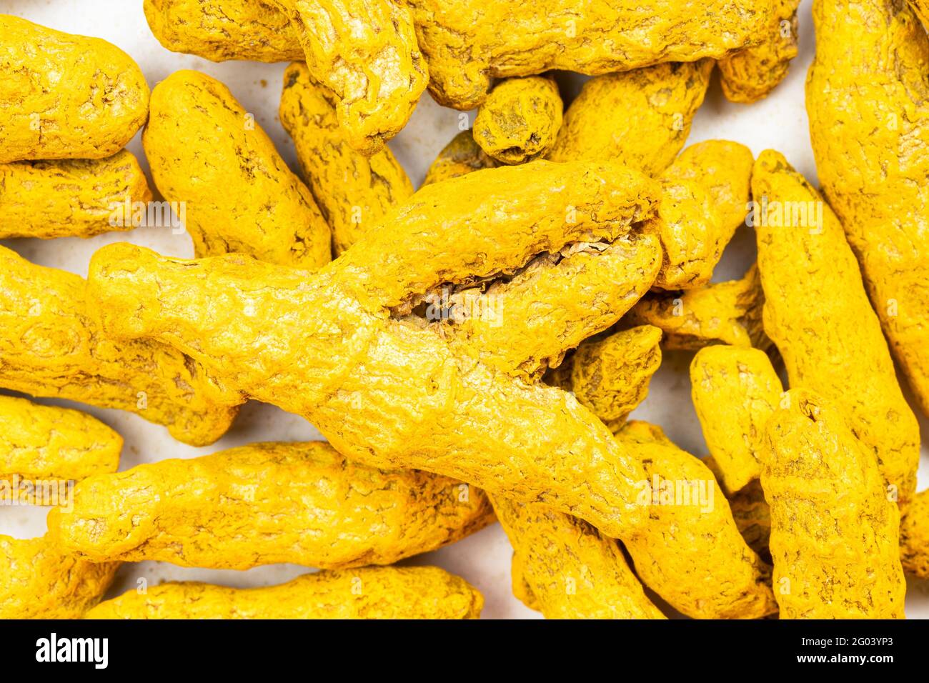 food background many whole Turmeric (Curcuma) roots Stock Photo Alamy