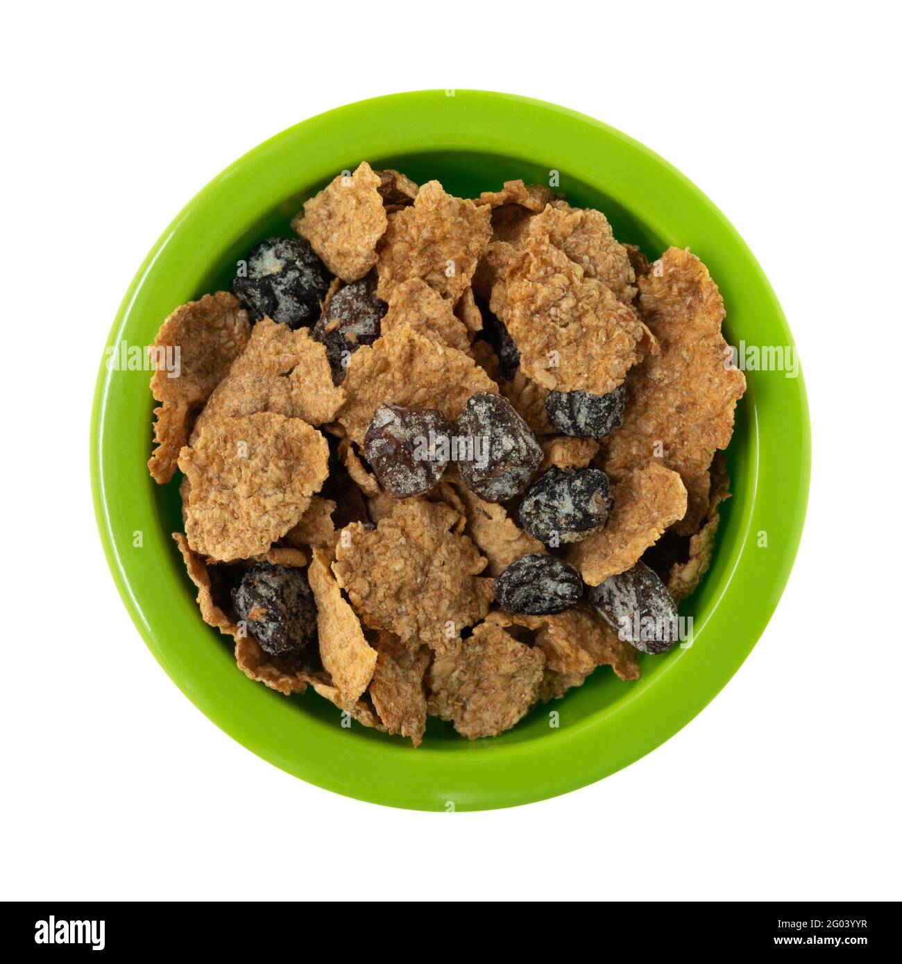 Top view of generic bran flakes with raisins in a green bowl isolated on a white background. Stock Photo