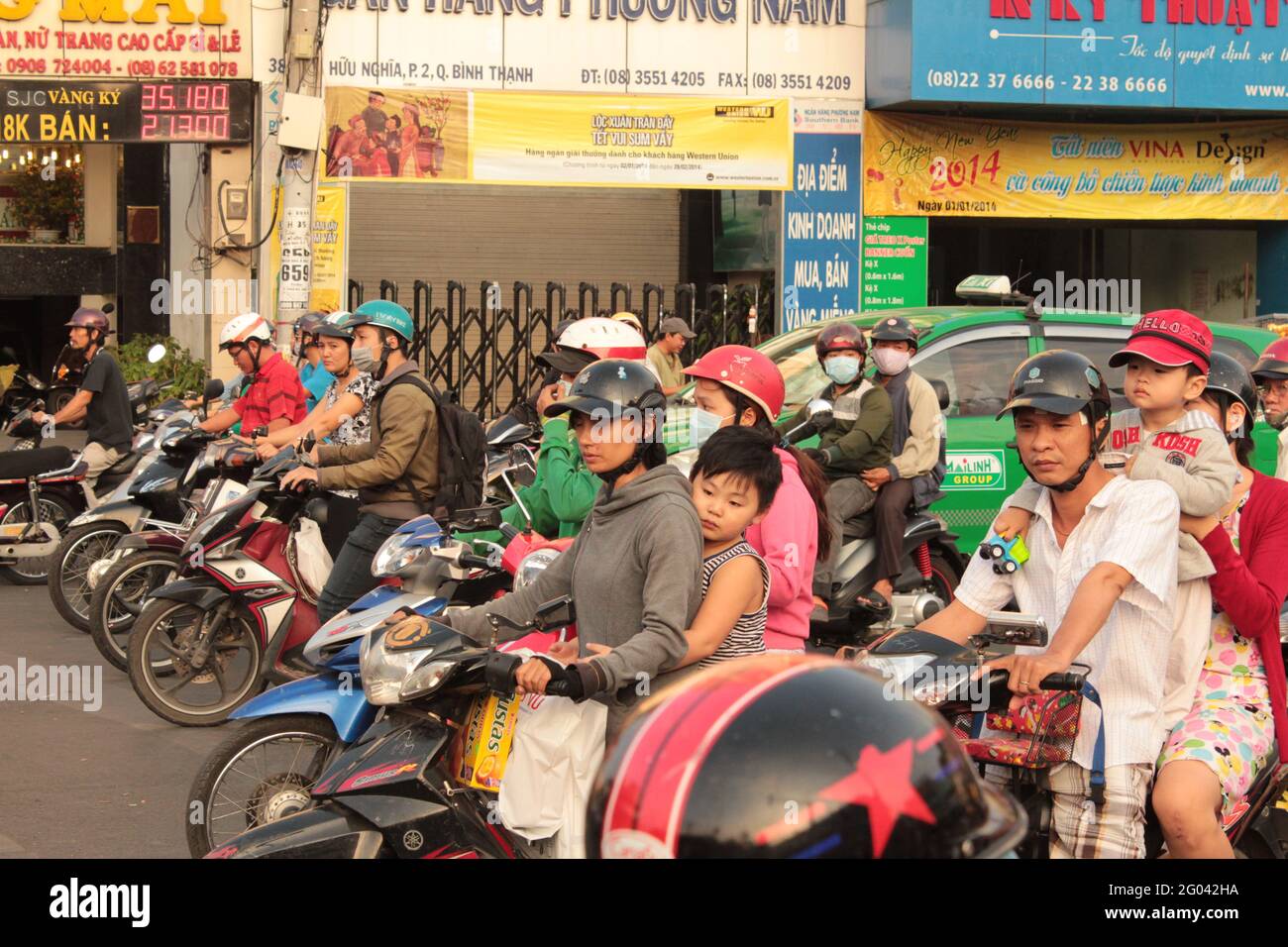 Saigon, Vietnam - January 2014: Scooter traffic in Saigon, Vietnam Stock Photo