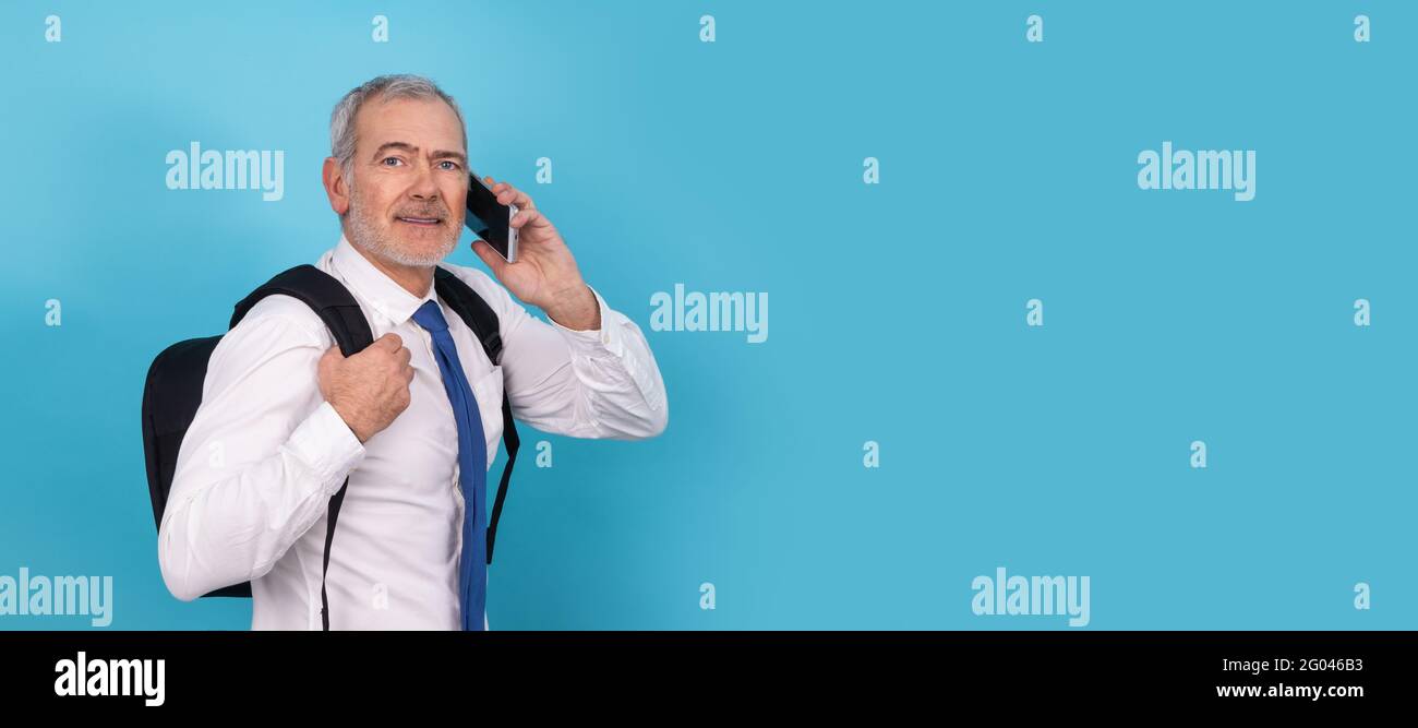 businessman with mobile phone and backpack isolated on background Stock Photo