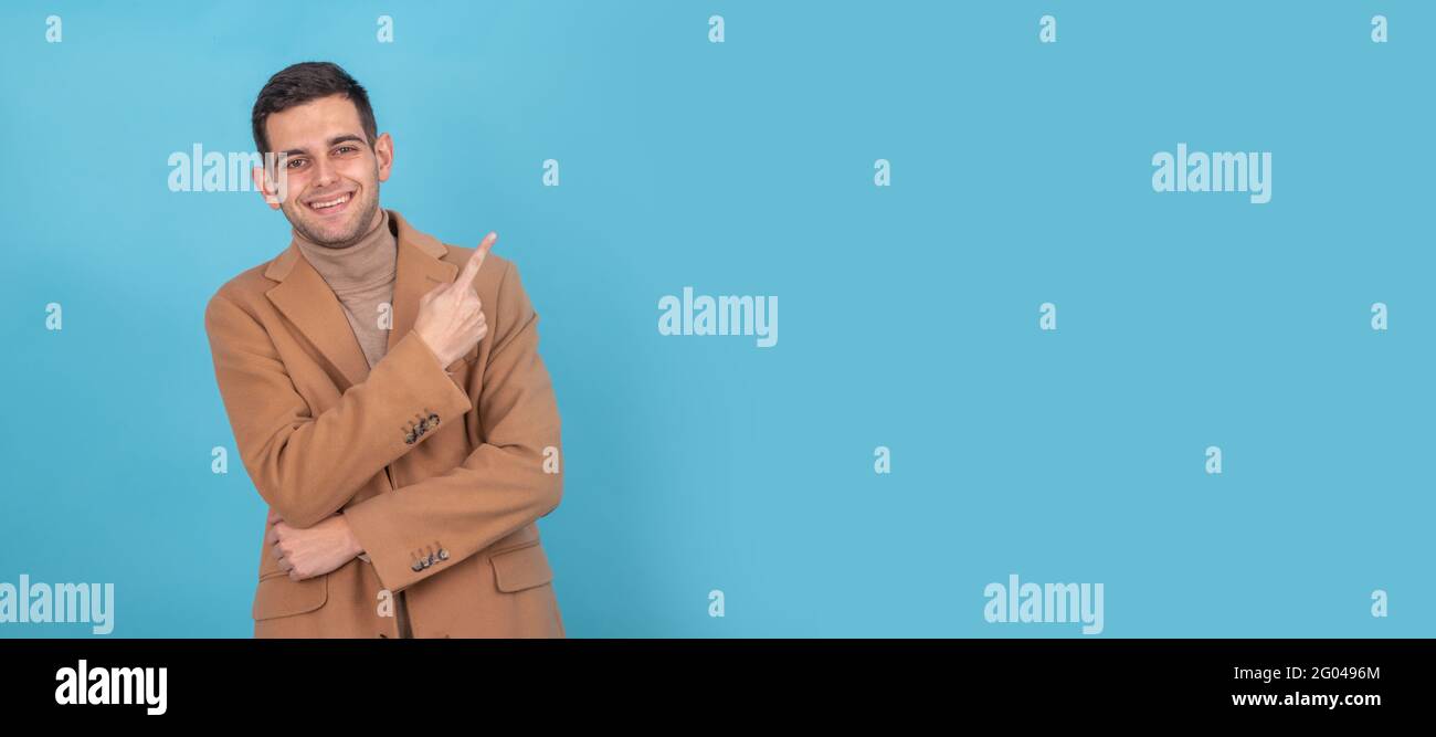 man with isolated coat pointing Stock Photo