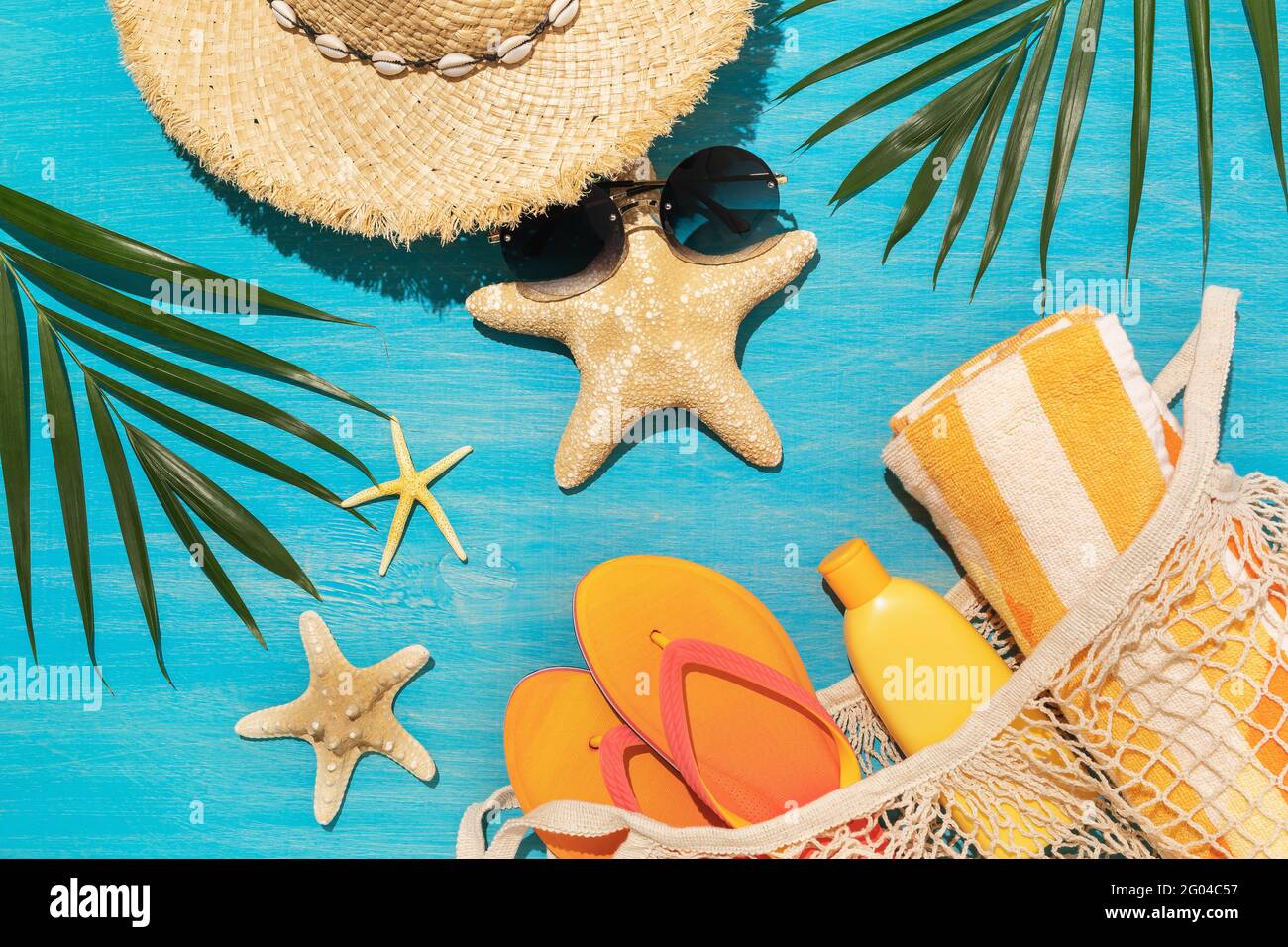 Beach supplies, decorative starfish and chico leaves on blue background Stock Photo Alamy