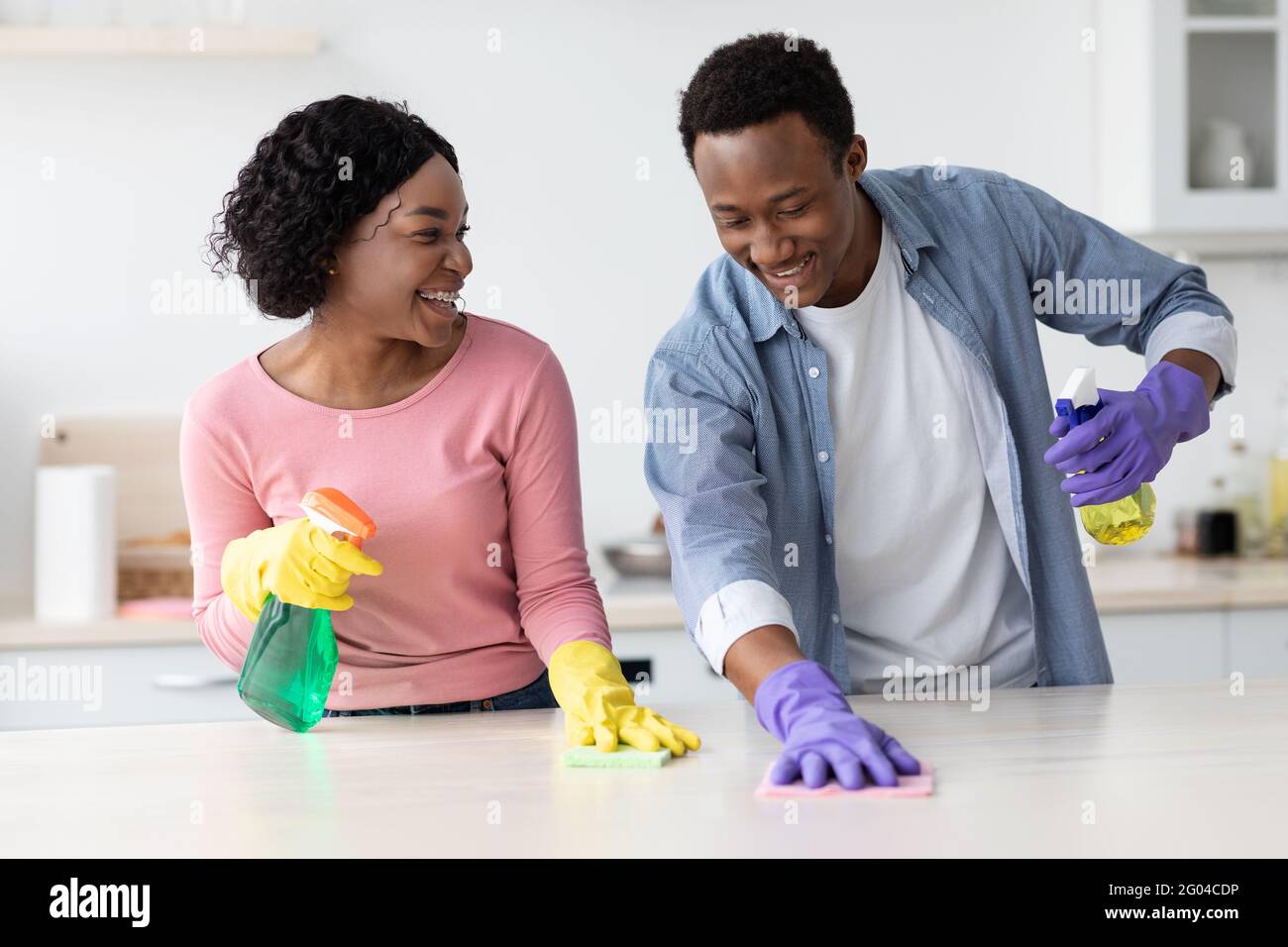 Black female cleaning home hi-res stock photography and images - Alamy