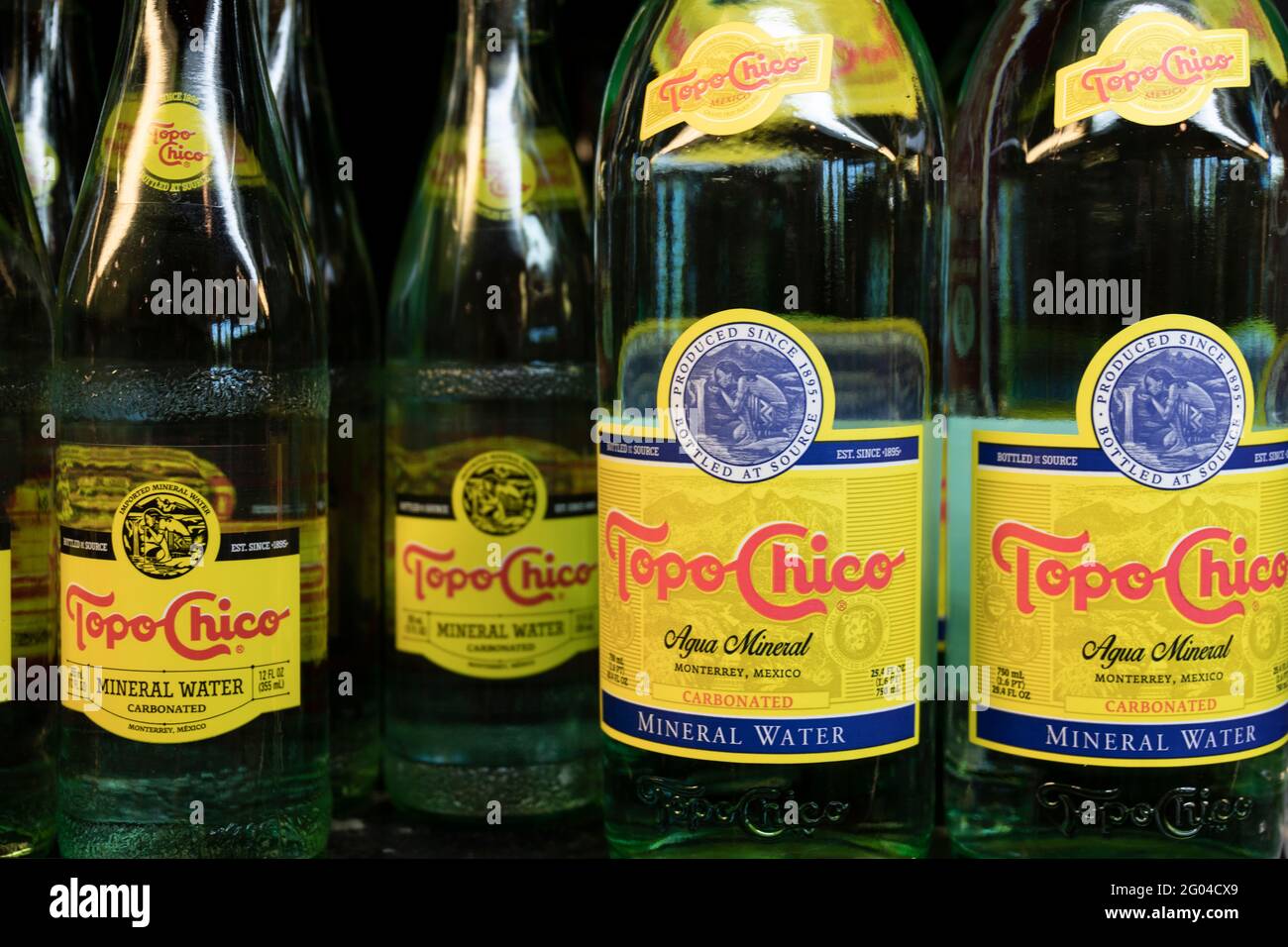 Indianapolis - Circa May 2021: Topo Chico bottled sparkling mineral water display. Topo Chico is a product of Coca Cola. Stock Photo