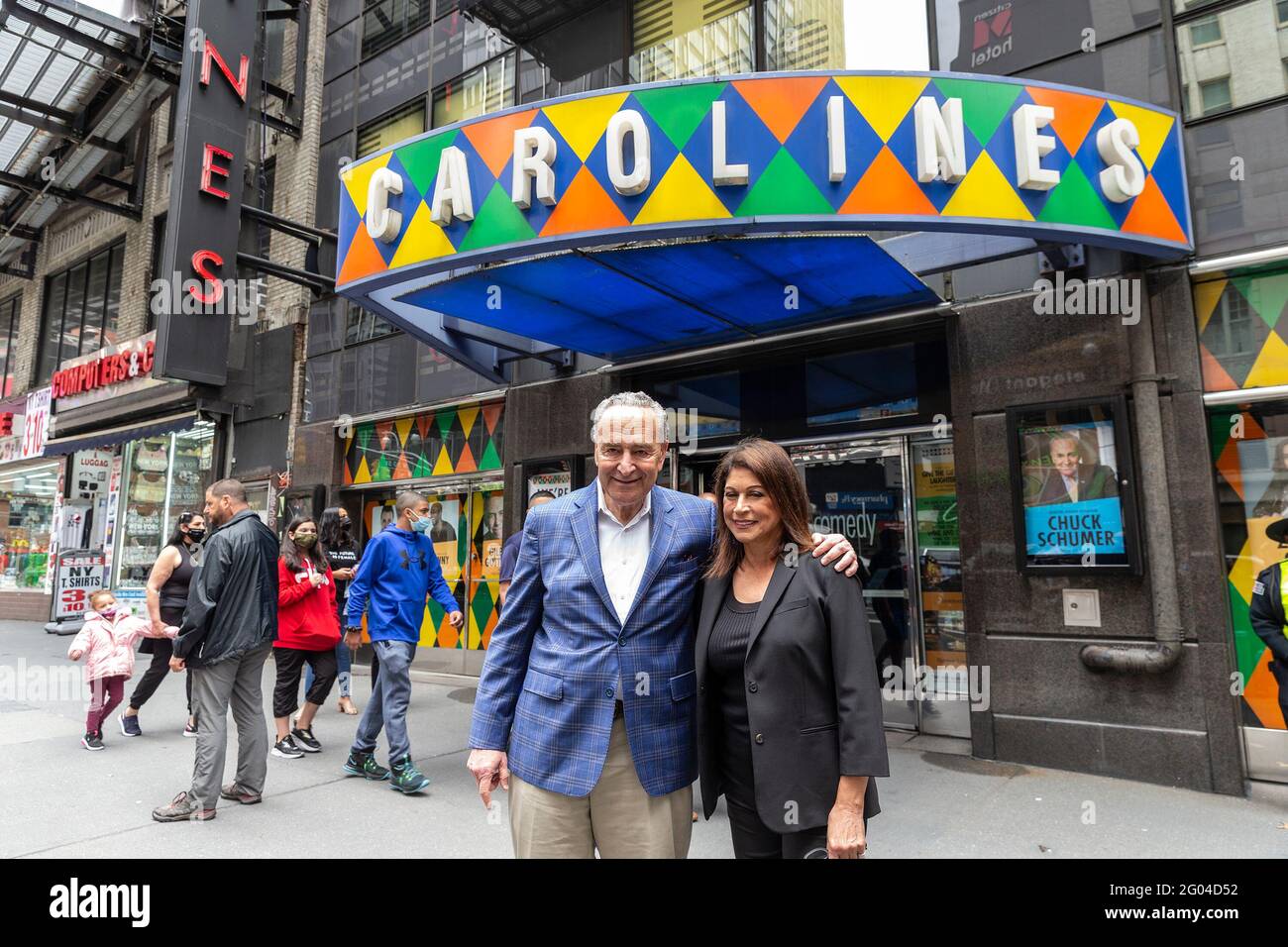 New York, United States. 31st May, 2021. U. S. Senator Charles Schumer and Caroline Hirsch pose outside of Carolines on Broadway comedy club after re-opening ceremony. Senator Charles Schumer lauded Safe our Stages (SOS) bill passed by Senate to help cultural venues to survive pandemic. He also cracked few jokes saying it is comedy club he does not have a choice but say them. (Photo by Lev Radin/Pacific Press) Credit: Pacific Press Media Production Corp./Alamy Live News Stock Photo