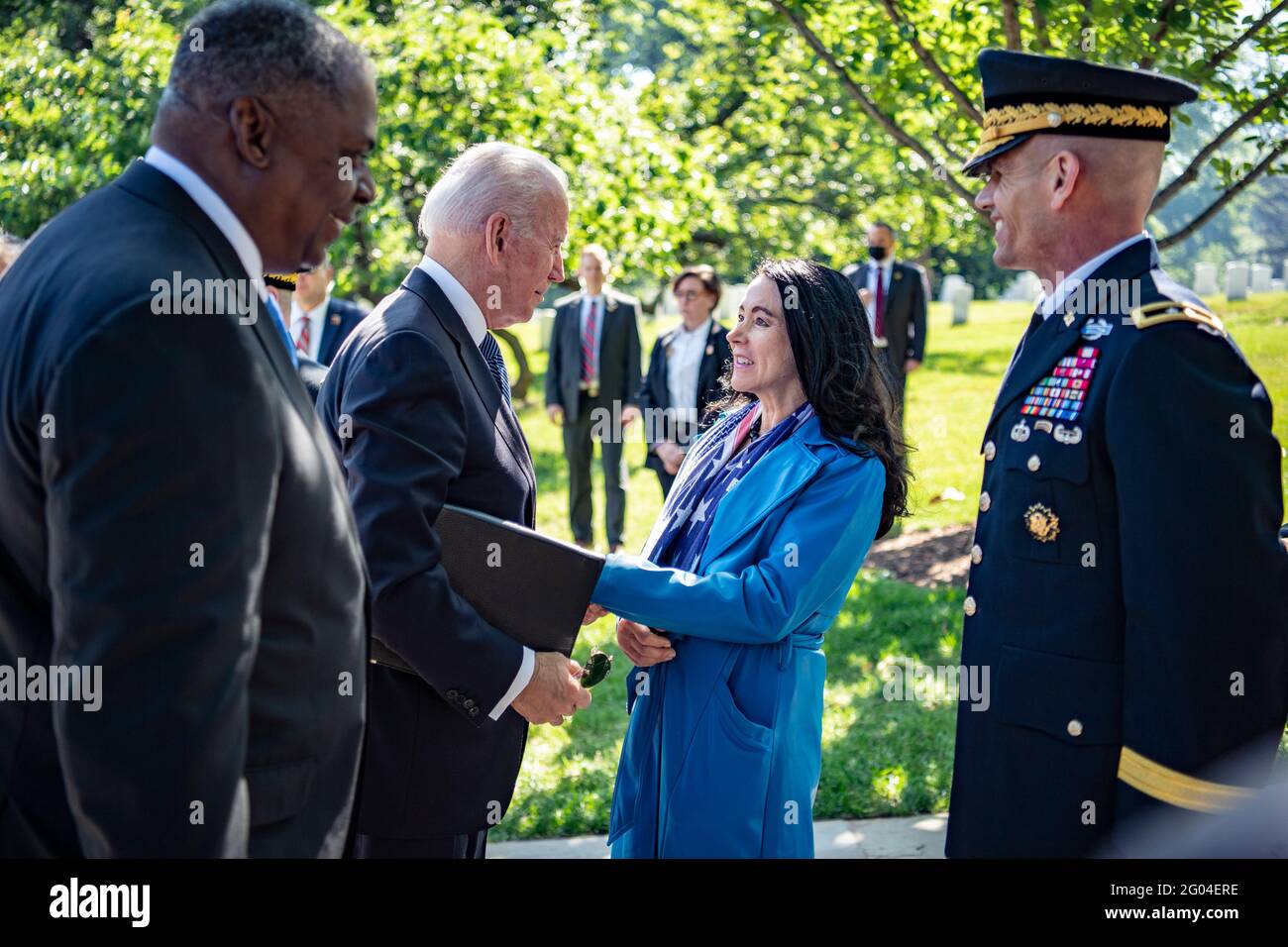 Arlington, United States Of America. 31st May, 2021. U.S President Joe Biden, is welcomed by Karen Durham-Aguilera, center, executive director, Army National Military Cemeteries on his arrival for the National Memorial Day Observance at Arlington National Cemetery May 31, 2021 Arlington, Virginia. U.S. Army Maj. Gen. Omar Jones IV, right, commanding general, Joint Task Force-National Capitol Region and Secretary of Defense Lloyd Austin III left, look on. Credit: Planetpix/Alamy Live News Stock Photo