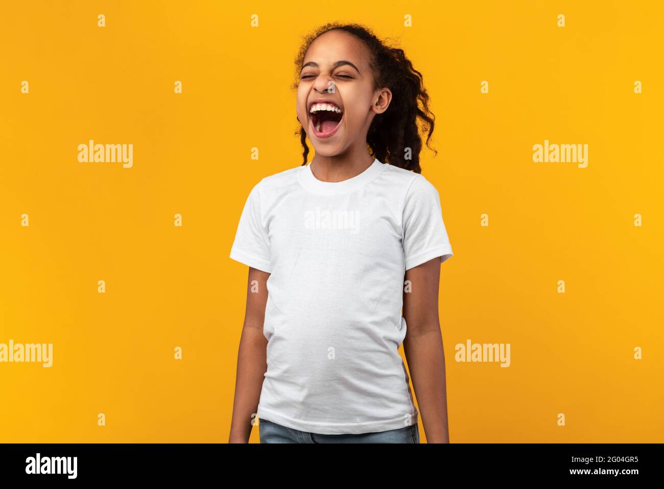 Cute Joyful African American Girl Laughing At Studio Stock Photo - Alamy