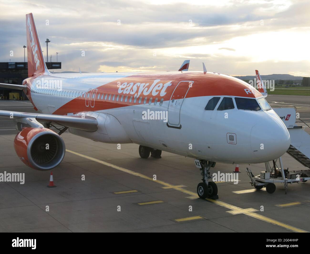 An easyJet plane with the steps in place ready for passengers to embark for their flight; Glasgow airport, May 2021. Stock Photo