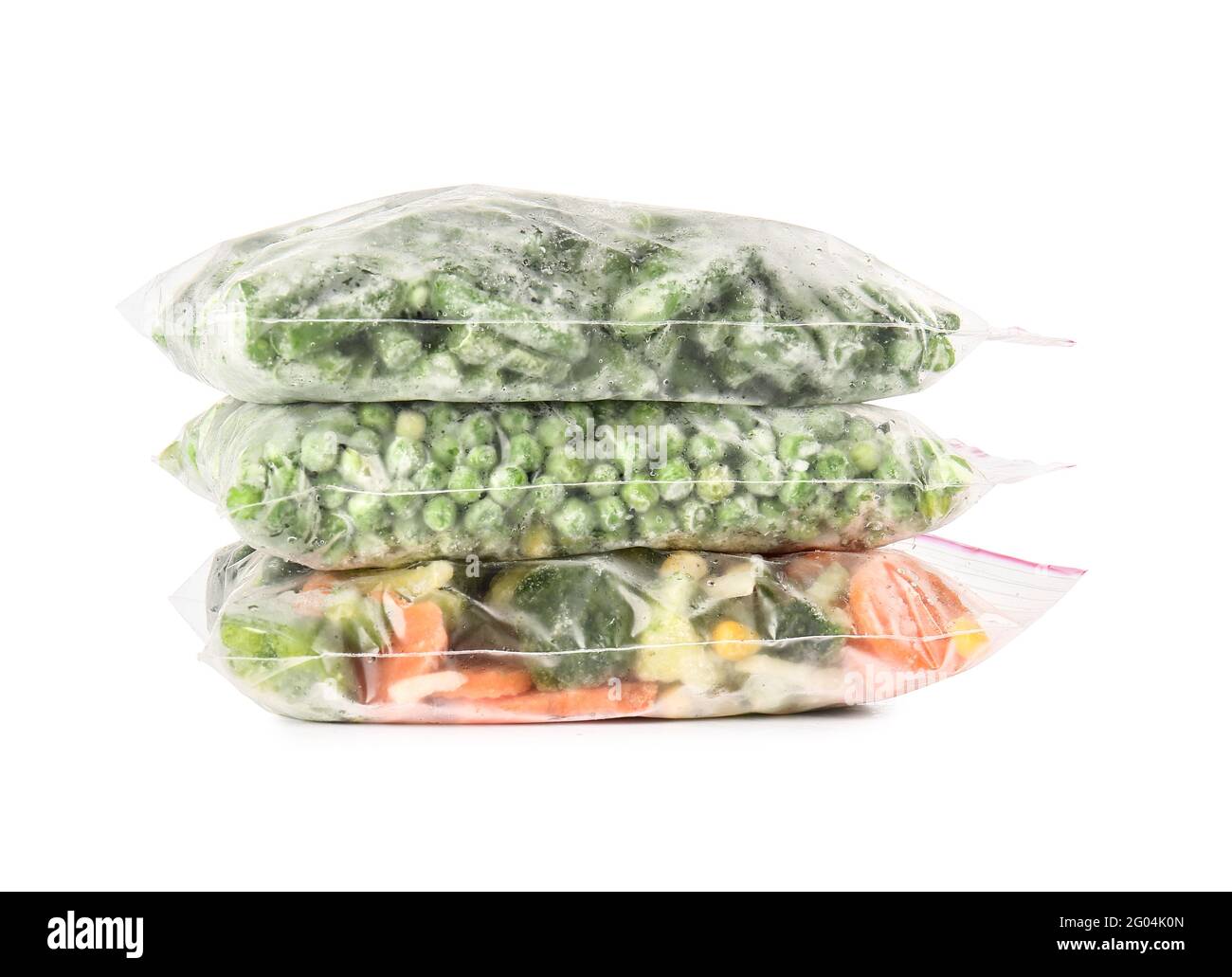 Plastic bags with frozen vegetables on white background Stock Photo Alamy