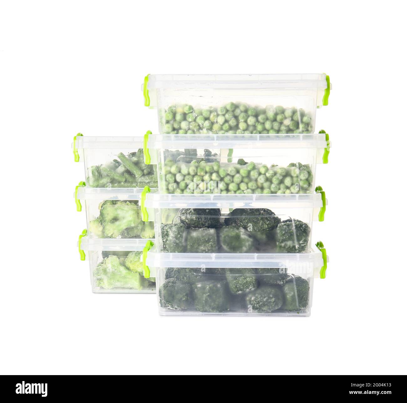 Plastic containers with frozen vegetables on white background Stock