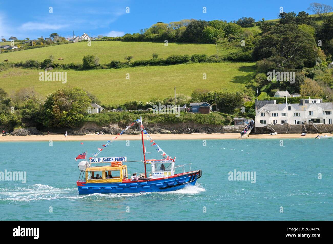Tourists on the South Sands ferry boat on the Kingsbridge Estuary with East Portlemouth beach in the background, Salcombe, Devon, England, UK Stock Photo