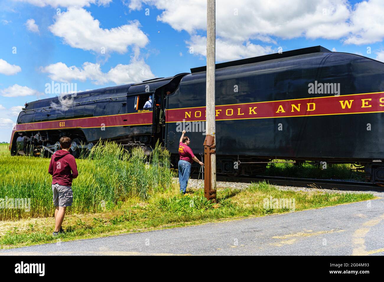 Strasburg, PA, USA - May 31, 2021: Photographers capture images of the Norfolk and Western 611, the sole survivor Class J steam locomotives, on the St Stock Photo