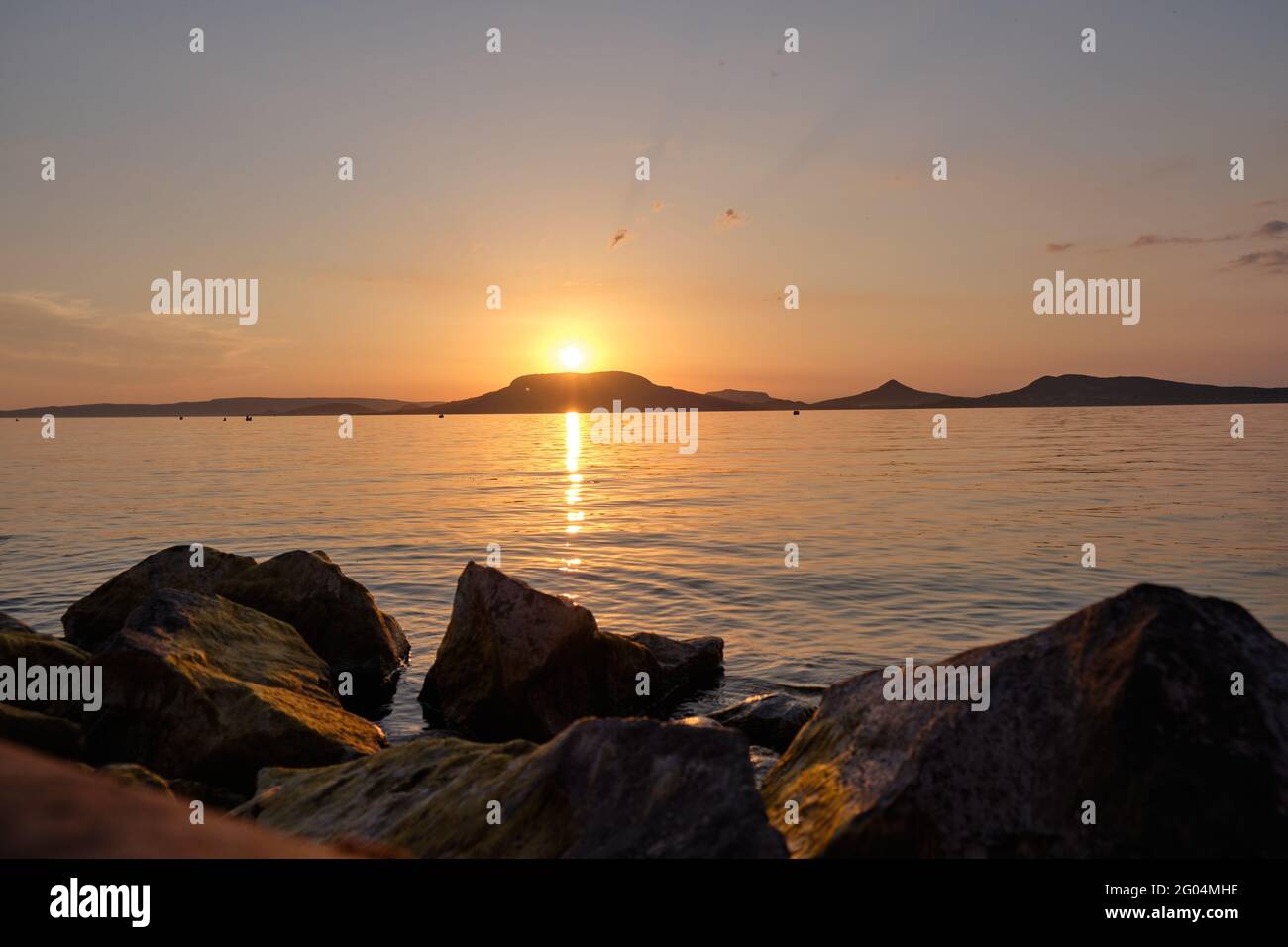 Beautiful view of the stunning sunset sky reflecting in the peaceful ...