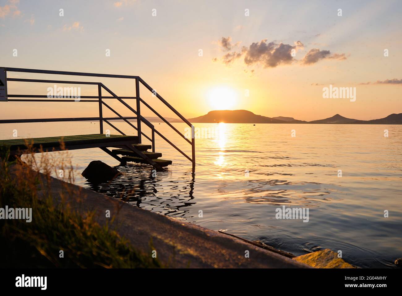 Beautiful view of the stunning sunset sky reflecting in the peaceful ...
