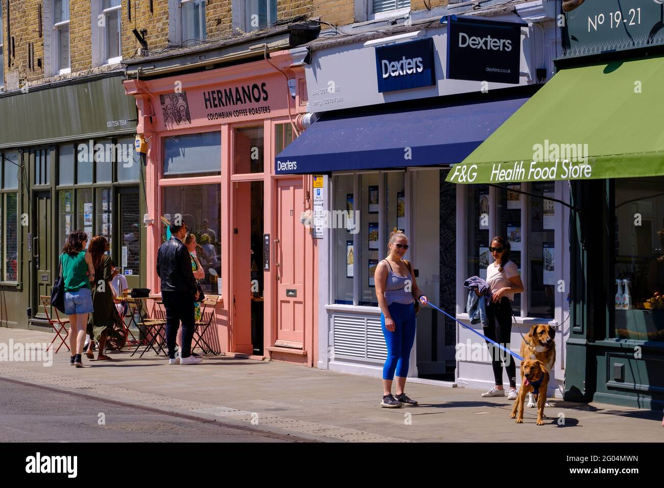 People enjoy warm summer day after covi-19 lockdown restrictions are being lifted and economy is opening up, Broadway Market, London, United Kingdom Stock Photo