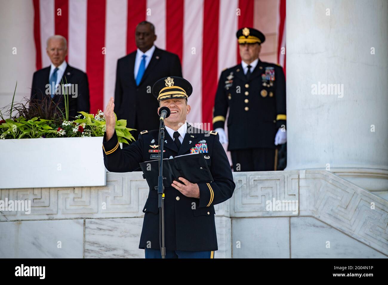Arlington, United States Of America. 31st May, 2021. U.S. Army Chaplain Col. Michael Shellman provides remarks during during the annual Memorial Day commemoration in the Memorial Amphitheater at Arlington National Cemetery May 31, 2021 Arlington, Virginia. Standing behind Shellman are U.S President Joe Biden, left, Secretary of Defense Lloyd Austin and Joint Chiefs Chairman Mark Milley, right. Credit: Planetpix/Alamy Live News Stock Photo