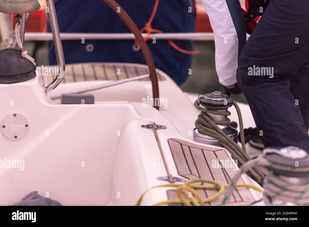 We wind the mooring lines on the winch on the yacht. The sailor throws ...