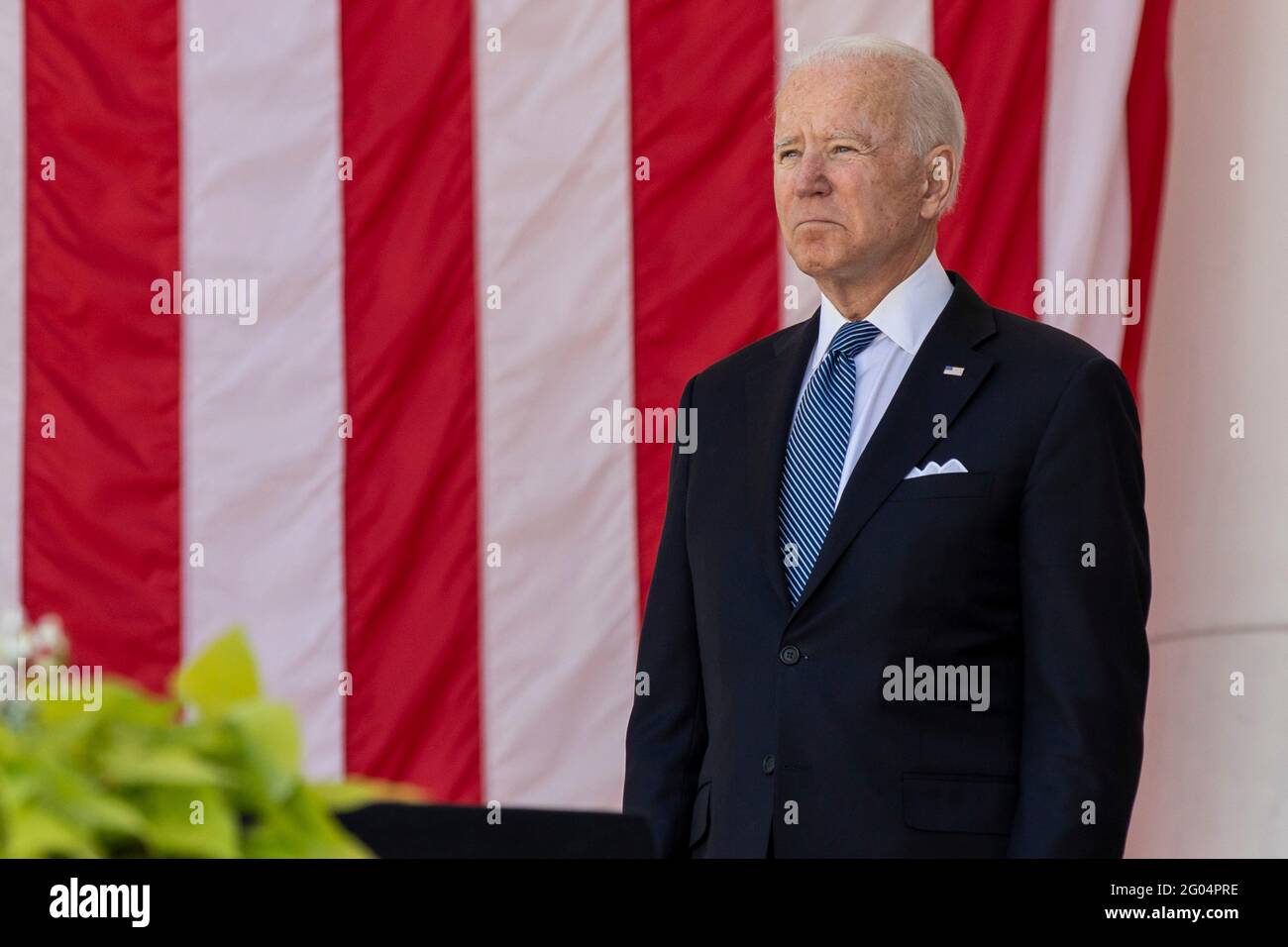 Arlington, United States Of America. 31st May, 2021. U.S President Joe Biden stands at attention during the annual Memorial Day commemoration in the Memorial Amphitheater at Arlington National Cemetery May 31, 2021 Arlington, Virginia. Credit: Planetpix/Alamy Live News Stock Photo