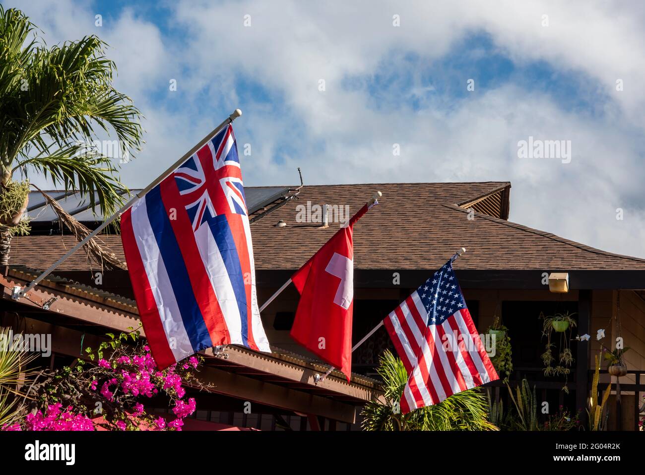 Maui, Hawaii. Hawaiian flag, the flag of Switzerland and the American