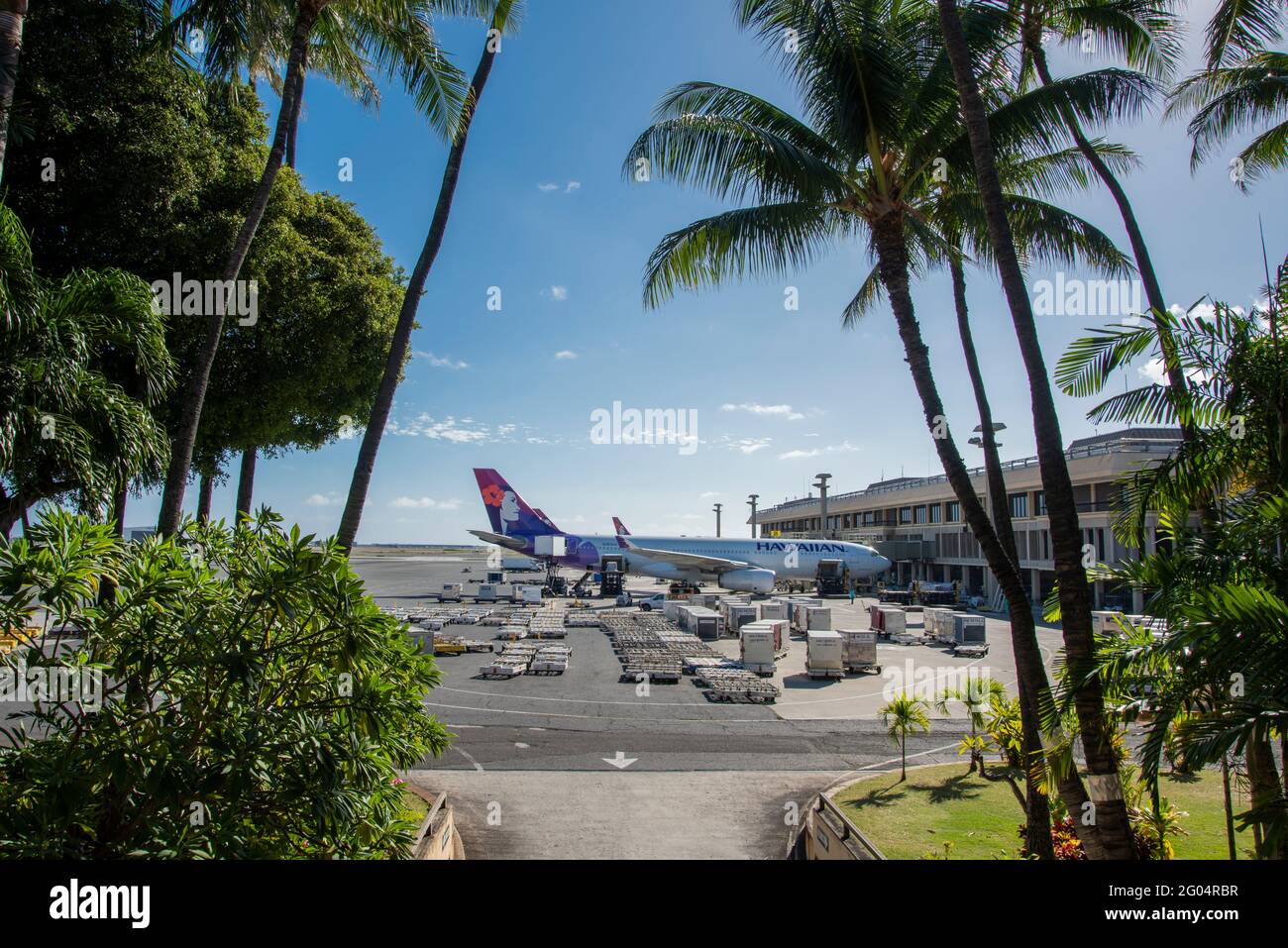 Honolulu, Hawaii. Hawaiian airlines airplane being fueled and loaded for the next flight at the Daniel K. Inouye International Airport. Stock Photo