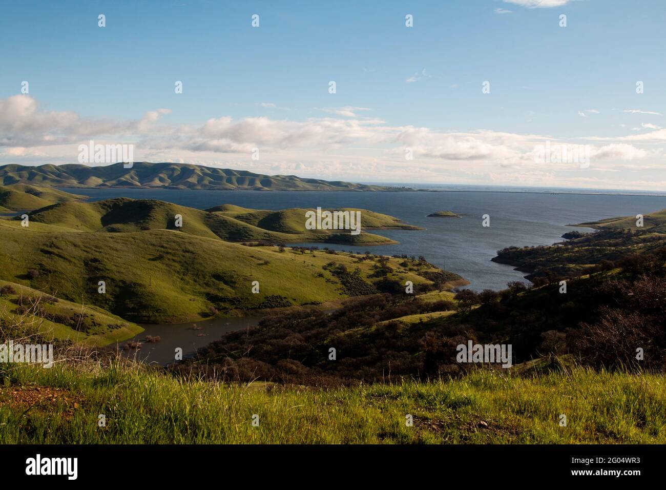 The San Luis Reservoir, located in Merced County, is an artificial lake, constructed to store irrigation water.  It is California's 5th largest lake. Stock Photo