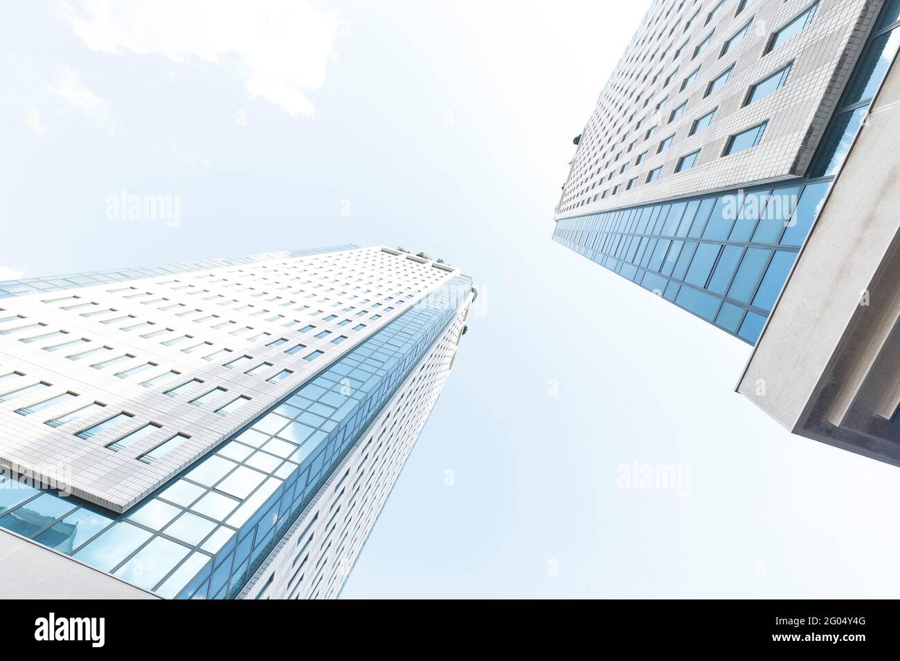 Low angle view of tall buildings against a blue sky Stock Photo - Alamy