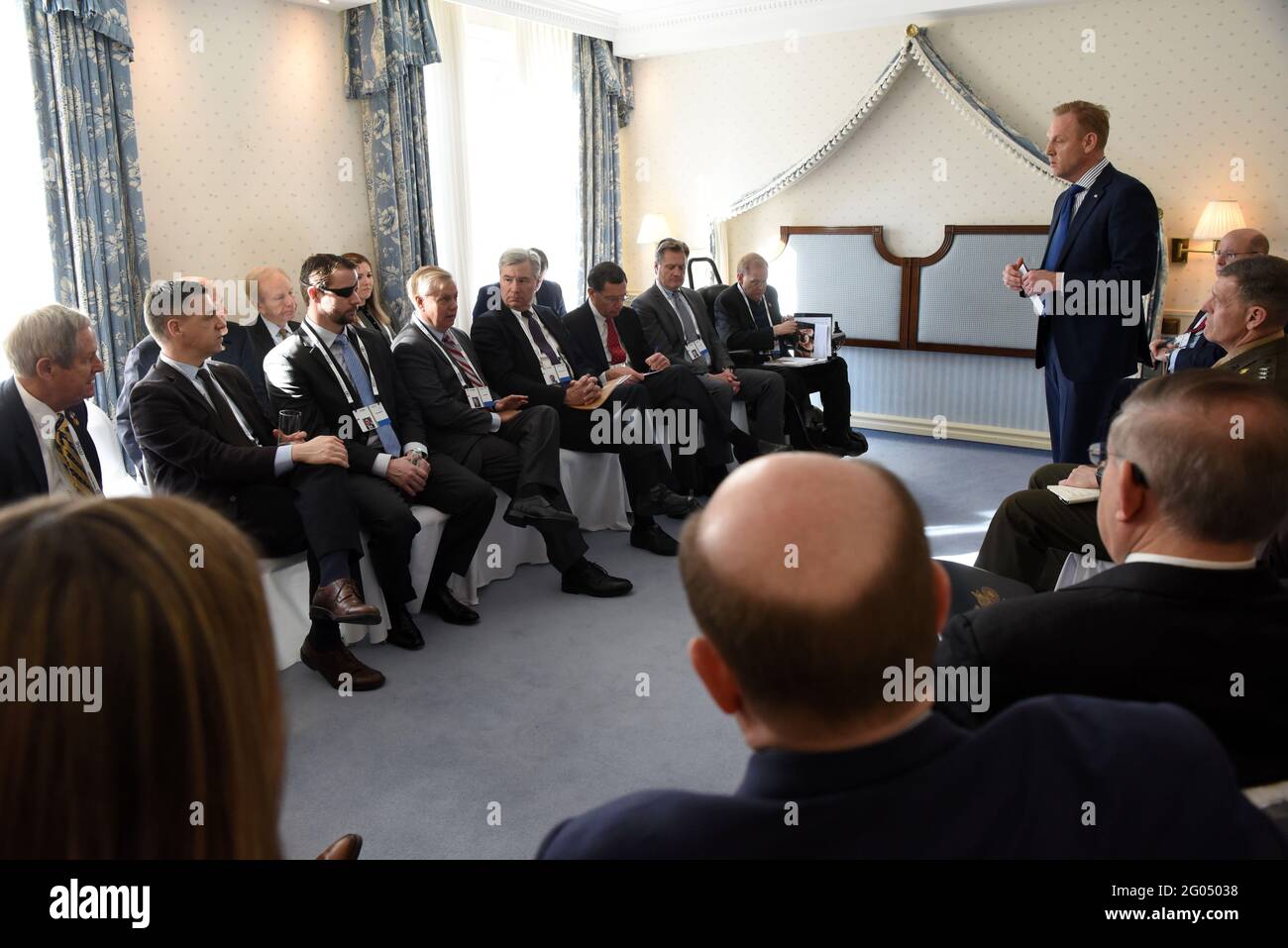 Reportage:   U.S. Acting Secretary of Defense Patrick M. Shanahan meets with a congressional delegation led by U.S. Senator Lindsey Graham, on the sidelines of the Munich Security Conference, Munich, Germany, Feb. 16, 2019. Stock Photo