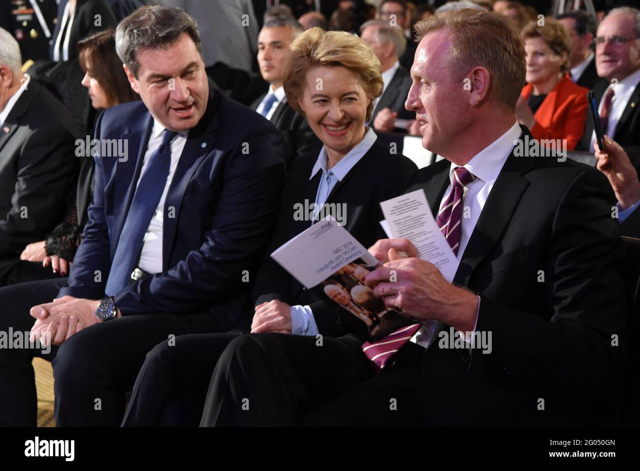 Reportage:   U.S. Acting Secretary of Defense Patrick M. Shanahan talks with German Minister of Defense German Minister of Defense Ursula von der Leyen and the Minister President of Bavaria, Markus SÃ¶der, at the Munich Security Conferenceâ€™s Inaugural John McCain Award Ceremony, Munich, Germany, Feb. 15, 2019. Stock Photo