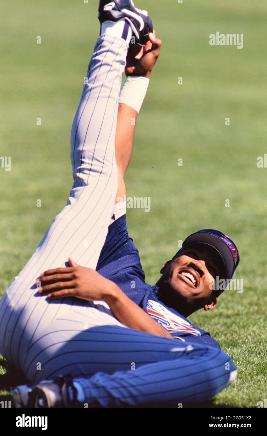 Major League Baseball player doing pre-game stretching, possibly Garret Anderson -- Please credit photographer Kirk Schlea Stock Photo