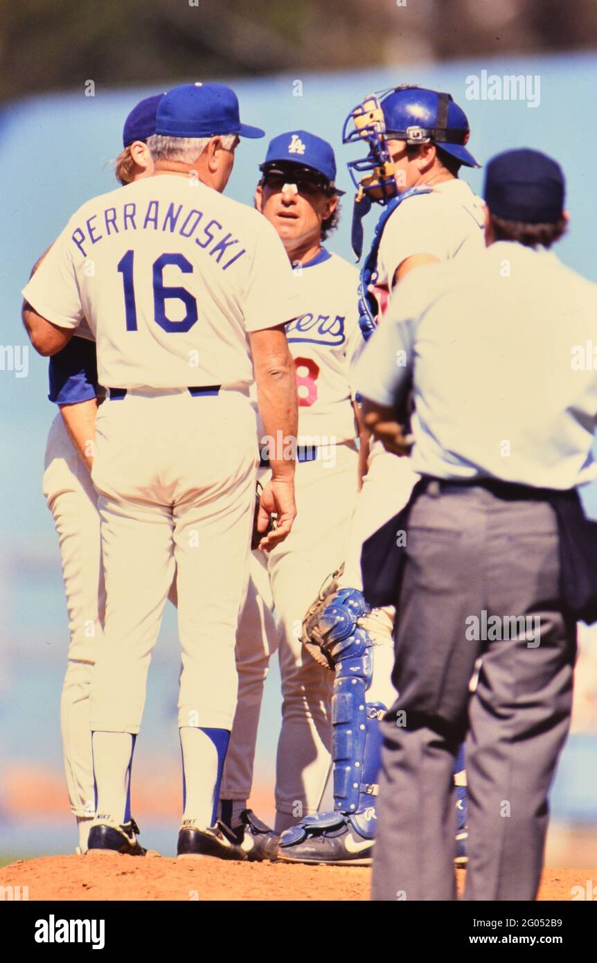 Los Angeles Dodgers pitching coach Ron Perranoski conducts a meeting on the mound -- Please credit photographer Kirk Schlea Stock Photo