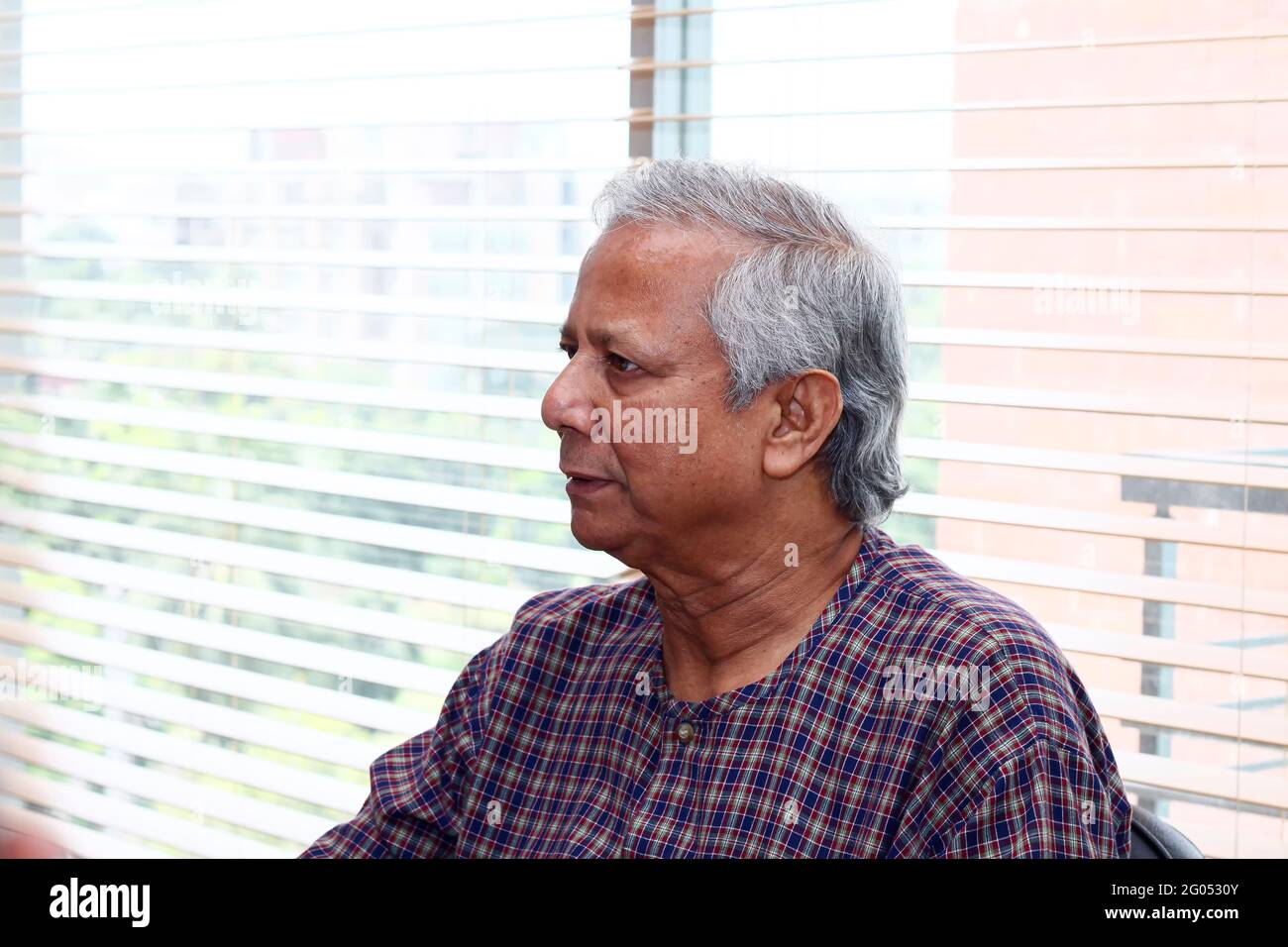 Bangladesh – September 20, 2012: Muhammad Yunus, a Bangladeshi social entrepreneur, banker, economist, and civil society leader is listening to the di Stock Photo