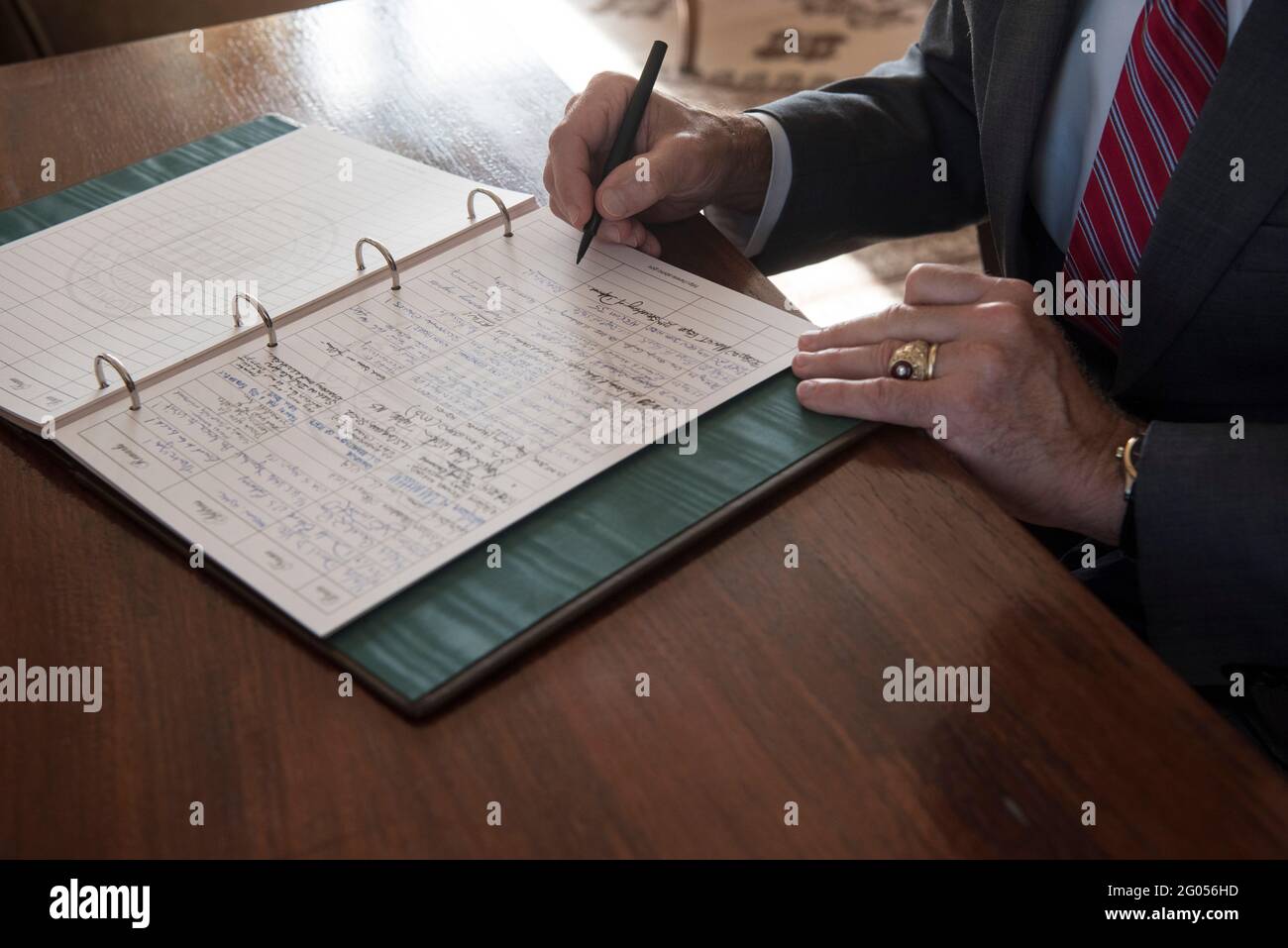 Reportage:  Defense Secretary Dr. Mark T. Esper signs the guest book at the North African American Cemetery and Memorial, Carthage, Tunisia, Sept. 30, 2020. Stock Photo