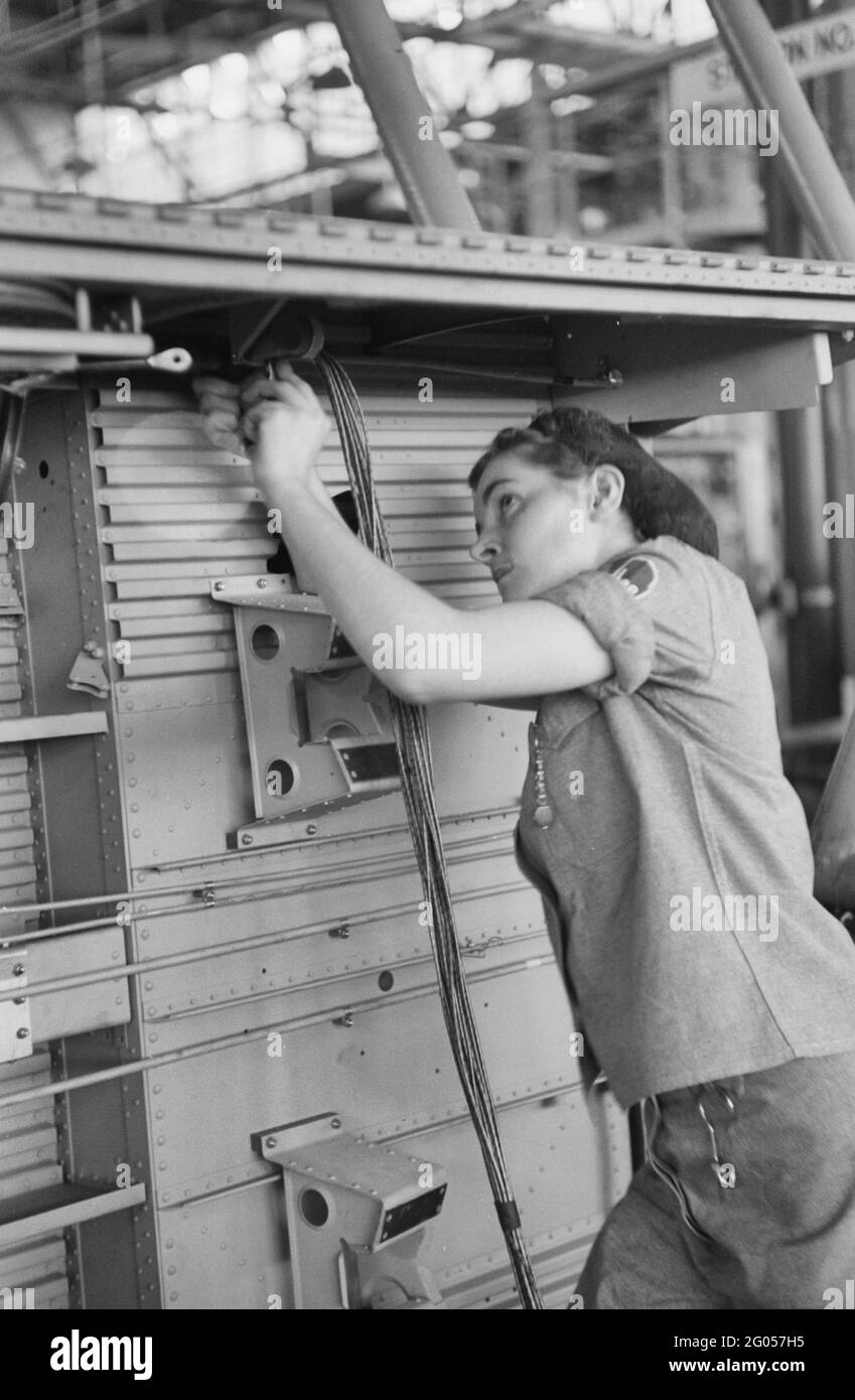 Vultee Aircraft Company. Installing electric wiring in a fuselage, Nashville, Tennessee, August 1942 Stock Photo