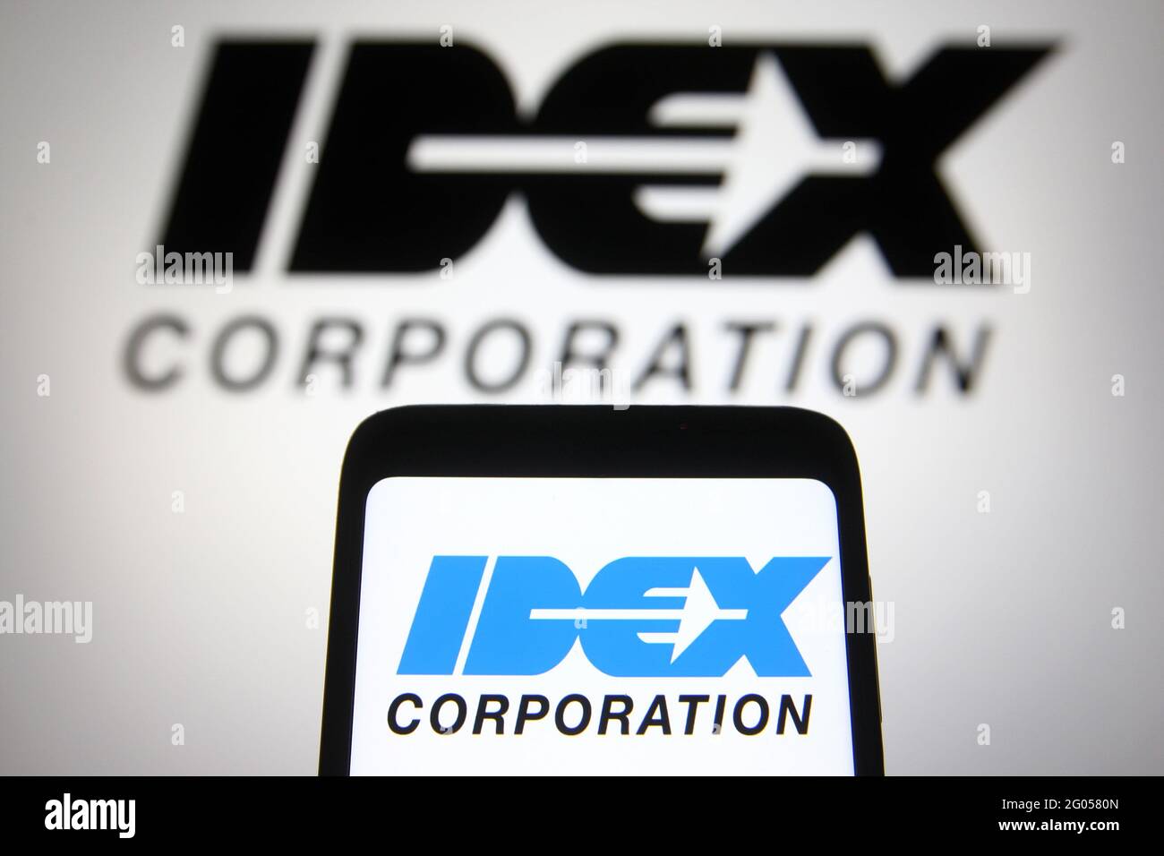 Ukraine. 31st May, 2021. In this photo illustration the IDEX Corporation logo is seen on a smartphone and a pc screen. Credit: SOPA Images Limited/Alamy Live News Stock Photo